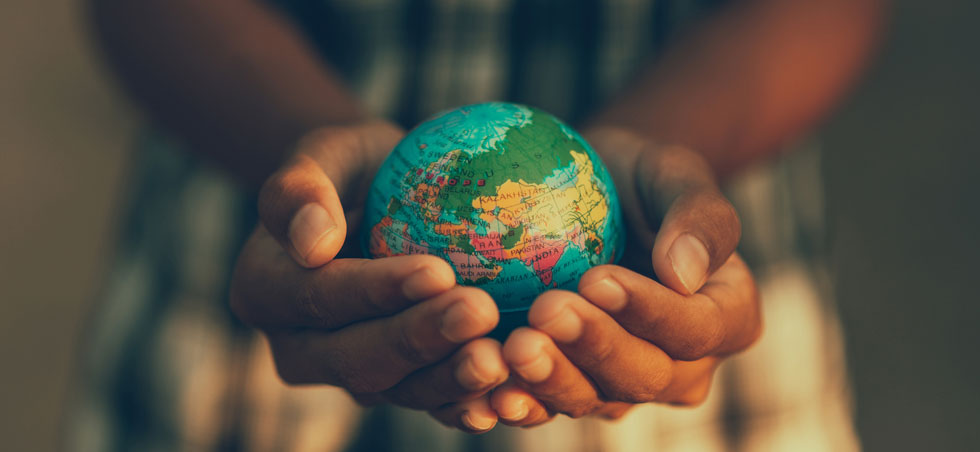 iStock 1368023303 Child holding globe